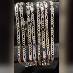 Silver chains displayed on black velvet background.